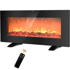 an electric fireplace with remote control and flames on the side, shown in front of a white background