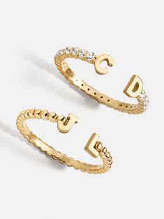 Orders placed through 11/26 11:59pm EST will be delivered by 12/19.Our 18K Gold Double Initial Custom Ring is an updated take on a classic initial accessory. Available in an all-gold and a subtle sparkly version, these rings are ones you'll have for years to come. Add your own initials or that of you and a loved one to create a keepsake you'll cherish. Not to mention, this ring is crafted with 18K gold plated sterling silver and Cubic Zirconia stones. Preppy Jewelry, Ups Shipping, Initial Earrings, 18k Gold Earrings, Opal Ring Gold, Jewelry Essentials, Initial Ring, Custom Ring, Initial Jewelry