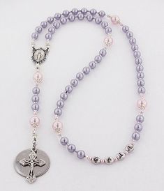 "This girls baptism rosary is a beautiful personalized baptism or christening gift. It is available with or without a Name in beads and with or without an Engraved Disc. The light purple and light pink rosary is made with all Genuine Swarovski Pearls and Swarovski Super Sparkly Crystals. It comes with your choice of a gift message that is elegantly boxed for simple gift giving. Add a Name in Beads - Select a name option. - Enter a name that is 10 characters or less. The name will be placed in th Pink Rosary, Personalized Rosary, Girl Christening, Pink Swarovski, Baptism Girl, Rosary Catholic, Rosary Beads, Baptism Gifts, Christening Gifts