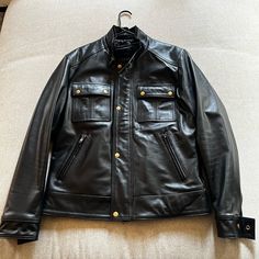 Size Medium In New Condition Never Worn Out Of Home. Black Business Biker Jacket With Pockets, Black Moto Leather Jacket With Pockets, Classic Biker Jacket With Pockets For Biker Events, Luxury Black Biker Jacket With Pockets, Black Luxury Biker Jacket With Pockets, Luxury Black Biker Jacket, Black Biker Jacket With Pockets, Classic Biker Jacket For Outdoor, Luxury Black Biker Jacket For Biker Events