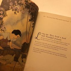 an open book with pictures of children and flowers on it's pages, showing the title page