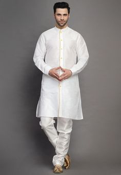 Art Silk Kurta in Off White.This Readymade attire is Enhanced with Buttons. Crafted in Chinese Collar Neck and Full Sleeve. Available with an Art Silk Churidar in Off White. Do note: Footwear shown in the image is for presentation purposes only. Half to one inch may vary in measurement. (Slight variation in actual color vs. image is possible). We sell all kinds of menswear. Mens Kurta | Mens Kurta Pajama | Mens Sherwani | Mens Sherwani Sets | Traditional Menswear | Partywear Menswear | Indian Me White Summer Sets With Set-in Sleeves, White Cotton Kurta With Pallu, Traditional White Sets With Set-in Sleeves, White Straight Kurta Set For Puja, White Long Sleeve Traditional Wear For Puja, White Straight Kurta For Puja, Fitted White Traditional Wear For Puja, Fitted Cotton Kurta With Set-in Sleeves, White Fitted Sets For Puja