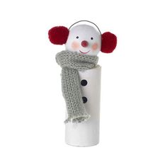 a snowman wearing a scarf and hat on top of a tube