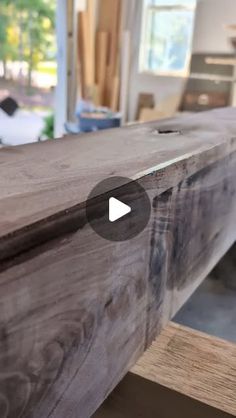 a close up of a wooden bench in a room