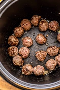 the meatballs are being cooked in the slow cooker for dinner or appetizing