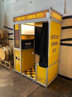 there is a small yellow and black drink kiosk