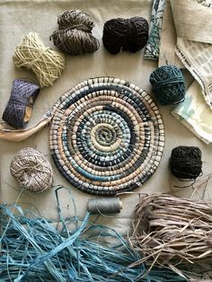 several balls of yarn are laid out on a table