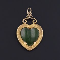 This antique piece (circa 1880-1900) features a jade heart set in 14k gold with a textured gold nugget surface. The piece measures 1.45 inches from the top of the jump ring to the bottom by 0.9 inches wide and is in excellent condition. Materials: 14k gold, jade, gold nugget. Antique Jade Jewelry For Anniversary, Vintage Green Heart-shaped Jewelry, Antique Engraved Jade Jewelry, Antique Jade, Jewelry Post, Gold Nugget, Gold Texture, Antique Shops, Jump Rings