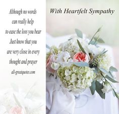 a bouquet of flowers sitting on top of a table next to a poem about sympathy