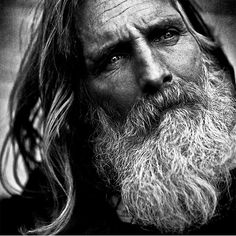 an old man with long hair and a beard