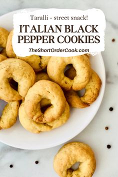 italian black pepper cookies on a white plate with the title text overlay reads taralli - street snack