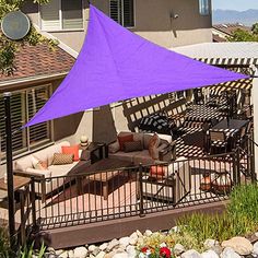 a purple triangle shade over a patio area