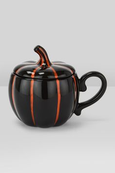 a black and orange striped tea pot