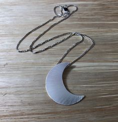 "Featuring the likeness of Stevie Nicks' own sterling silver 1 and 1/4\" crescent moon (20 gauge in thickness). Comes with an 18\" sterling silver box chain. The chain comes with a lobster claw for extra strength and security. The box chain is 1.2 mm thick so it's strong and sturdy. I draw the moon layout on sterling sheet, then pierce and cut the shape, solder the bail on the back so you can wear the moon towards your heart. Finally, I add a final matte finish for a magical and enchanting piece Moon Layout, Moon Waxing Crescent, Waning Crescent Moon, Waxing Crescent Moon, Waning Crescent, Crescent Moon Necklace Silver, Crescent Moon Pendant, Crescent Moon Necklace, Silver Box