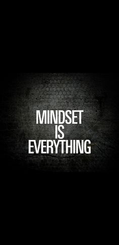 the words mindset is everything written in white on a black background with a brick wall