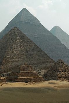 three pyramids in the desert near one another