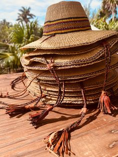 A true Island Sun Hat (Farmers Market Style) these beauties are thoughtfully handmade by talented Artisans and are intricately designed to last forever. They travel well and can be reshaped time and time again with cold water + sunlight ✨ Ideal for the beach, lake, pool or out on the boat or paddle board, these hats can easily transition with you through the seasons as they become your favorite sun hat, for any occasion. Woven from 100% South African raffia, the hat features a colorful striped p Farmers Hat, Raffia Palm, Straw Sun Hat, Catalina Island, Body Balm, Woven Raffia, Paddle Board, Store Front, Local Artisans