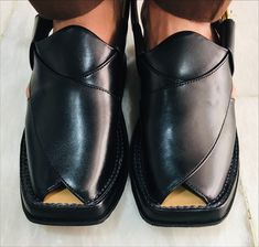 *This indigenous leather chappal craft from Pakistan showcases the skills of South Asian artisans and utilizes the finest quality leather. This jet-black leather Peshawari chappal not only elevates your style but also becomes a statement piece, enhancing your presence in any setting. Crafted with an additional sole for added comfort, our skilled artisans ensure precision and finesse in every stitch. *These exquisite handcrafted Peshawari Chappals are often referred to as Kaptaan Chappals or Imra Leather Sandals With Dabka And Round Toe, Traditional Black Slip-on Huarache Sandals, Traditional Black Sandals With Single Toe Strap, Traditional Black Closed Toe Sandals, Black Closed Toe Sandals For Festivals, Traditional Black Open Toe Huarache Sandals, Genuine Leather Sandals, Trendy Sandals, Sandals Casual