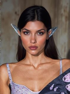 Ilithyia Glitter Elf Ears Elevate your elf costume to new heights with the Ilithyia Glitter Elf Ears, a must-have accessory for any fantasy or cosplay enthusiast. Crafted from premium materials and featuring an enchanting glitter design, these ears are designed to make you shine at every event. Why Choose Ilithyia Glitter Elf Ears? Unique Design: Stand out in a crowd with the whimsical and unique glitter pattern that will add an extra layer of magic to your elf costume. Premium Quality: Made fro Glitter Pattern, Elf Costume, Elf Ears, Glitter Design, Design Stand, Elf, Unique Design, Premium Quality, Unique Designs