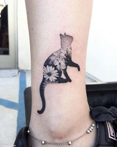 a cat with flowers on it's leg is shown in the shape of a flower