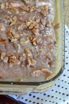 a glass baking dish filled with oatmeal and nuts