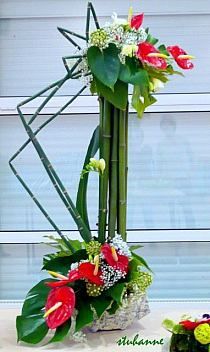 two vases filled with flowers on top of a table