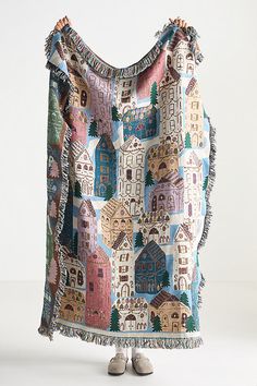 a woman's handbag with houses on it and fringes around the edges