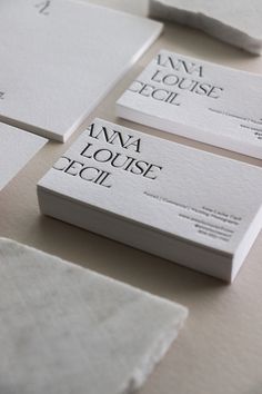 four business cards on top of each other