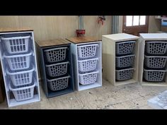 several storage containers are lined up on the floor