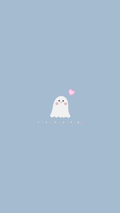 a white ghost floating in the air with a pink heart on its nose