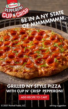 a pizza sitting on top of a grill covered in pepperoni