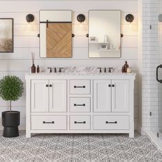 a bathroom with two sinks and mirrors on the wall