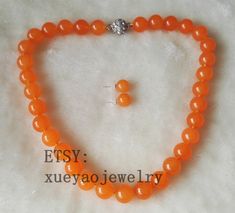 Welcome to my shop my dear friend. I hope you will like my jewelry, and most of my jewelry are made by myself. Please see the detail for this item: Pearl Jewelry: necklace set Pearl Type: jade Pearl Shape:round Pearl Color: orange size: 10 mm Length: can choose if you need other length, or other color, could contact me please! if you want dangle earrings, also can tell me please! About shipping: I will send out your order in 1-3 business days from China. 1, To United States, will use US E-packet Bracelet Flower, Pearl Jewelry Necklace, Jade Earrings, Flower Girl Gifts, Freshwater Pearl Bracelet, Jade Necklace, Pearl Types, Pearl Color, Jewelry Necklace