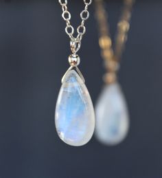 - THIS LISTING IS FOR ONE NECKLACE. - PHOTOS ARE ENLARGED. PLEASE REFER TO THE LAST TWO PHOTOS to get realistic size of the pendant. - Made with very good quality moonstone with blue flash. - The stone is available in two sizes * M (Medium) = around 16 x 7 x 4 mm * L (Large) = around 20 x 10 x 4 mm (The current photos are made with Medium size) - Sterling Silver or gold filled findings are used. - The chain is available in 1.4 mm thickness (chain shown in the photos of this listing) or 1.6 mm th White Teardrop Crystal Necklace For Gift, White Drop Crystal Necklace Gift, White Drop Crystal Necklace For Gift, Moonstone Teardrop Pendant Jewelry Gift, Moonstone Pendant Necklace, Moonstone Earrings, Silver Prices, Moonstone Necklace, Moonstone Pendant