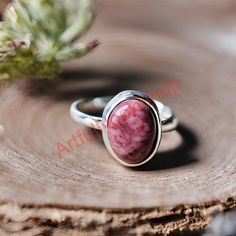 Pink Rhodonite Ring, 925 Sterling Silver Ring, Pink Stone Ring, Engagement Rings for Women, Promise Ring, Christmas Valentines Day Gift Comes in a Free Gift Box 🎁  Makes a Wonderful Gift for your Girlfriend, Wife, Mom or Simply an Excellent Addition to Your Jewelry Collection. ●Product Details:- *Product Type - Ring *Metal              - Sterling Silver *Stamp             - 925 *Gemstone      - Rhodonite *Gemstone Color - Pink (May vary in color and pattern) *Gemstone Shape - Oval *Gemstone Tre Rhodonite Ring, Pink Stone Ring, Pink Stone Rings, Pink Rhodonite, Engagement Rings For Women, Gifts For Your Girlfriend, Pink Stone, Ring Engagement, Rings For Women