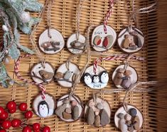 some ornaments are hanging on a wicker table