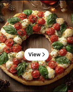 a pizza with tomatoes and mozzarella on it, surrounded by pine cones and christmas decorations