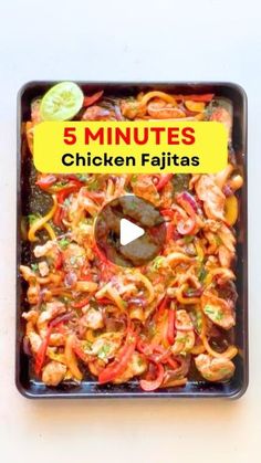 a pan filled with chicken fajitas on top of a table