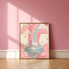 a pink room with a unicorn poster on the wall and wooden flooring in front of it