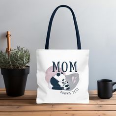 This is a tote bag made with 100% polyester, a medium-weight fabric that is highly durable.  The perfect gift for your loved one! *IMAGE PRINTED ON BOTH SIDES OF TOTE BAG* > Bag: Small (13 in x 13 in x 3.46 in) Medium (16 in x 16 in x 3.46 in) Large (18 in x 18 in x 3.46 in) > Handle: (Height 14 in x Width 1 in) > Non-woven laminate inside. > Reinforced stitching on handles. > Boxed corners to create extra space. > Props used in photos are NOT included with purchase! CARE INSTRUCTIONS > Remove a White Canvas Shoulder Bag For Mother's Day, White Bags With Large Capacity For Mother's Day, White Large Capacity Bag For Mother's Day, White Large Capacity Bags For Mother's Day, White Shoulder Bag With Letter Print For Mother's Day, Space Props, Mom Bag, Mom Tote Bag, Best Tote Bags