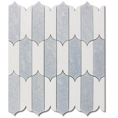 a white and grey tile with wavy lines