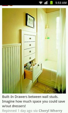 a white dresser sitting next to a bath tub