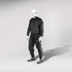 a white mannequin standing in front of a gray background wearing adidas clothing