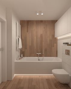 a modern bathroom with wood paneling and white bathtub in the center, along with wooden flooring