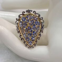 Everything About This Beauty Is Unique! From The Two Tone Sterling Silver And 14k Yg Overlay To The Pear Shaped Design To The Two Tone Band Design, This Ring Has It All! Marked 925 Size 8 Teardrop Tanzanite Jewelry In Yellow Gold, Yellow Gold Teardrop Sapphire Ring Fine Jewelry, Teardrop Sapphire Ring In Yellow Gold, Teardrop Yellow Gold Sapphire Ring, Gold Pear Shaped Ring With Rose Cut Diamonds, Pear-shaped Gold Ring With Rose Cut Diamonds, Pear-shaped Multi-stone Fine Jewelry Ring, Pear-shaped Yellow Gold Sapphire Ring, Fine Jewelry Yellow Gold Sapphire Ring Pear-shaped