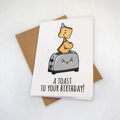 a toaster birthday card with two slices of bread sticking out of it's face