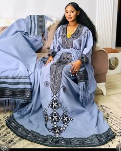 This elegant blue Habesha dress beautifully captures the essence of Ethiopian culture. With its traditional Habesha Kemis design, this Ethiopian traditional dress is perfect for celebrating cultural heritage and special occasions. Material Cotton Thread Estimated delivery : 2 weeks to 3 weeks Contact WhatsApp +1(304)-306-2784Email: contact@ethiopian.store Ethiopia Culture, Holiday Wedding Dress, Ethiopian Dresses, Amhara Culture, Ethiopian People, Ethiopian Culture, Habesha Dress, Ethiopian Traditional Dress, Habesha Kemis