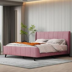 a bedroom with a pink bed and white walls