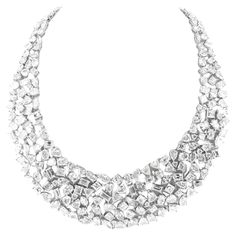 Introducing our magnificent Multi-Shape Diamond Necklace, a true masterpiece crafted in 18K white gold. This stunning necklace features an incredible 116 carats of mixed-shape diamonds, expertly arranged to create a dazzling display of brilliance. The combination of different diamond shapes adds a unique and captivating dimension to this luxurious piece, making it a perfect choice for those who appreciate both elegance and artistry. Elevate any occasion with this extraordinary necklace, designed to leave a lasting impression. Luxury Multi-strand Fine Jewelry Necklace, White Gold Necklace, White Gold Necklaces, Fine Jewels, Stunning Necklace, Multi Strand Necklace, Multi Strand, Diamond Shapes, Cartier