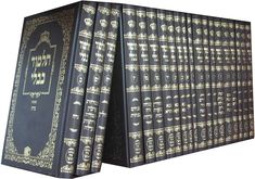 a large set of black and gold books